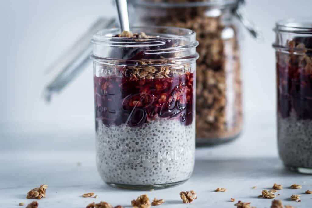 a jar of gluten free chia pudding breakfast parfait ready to eat