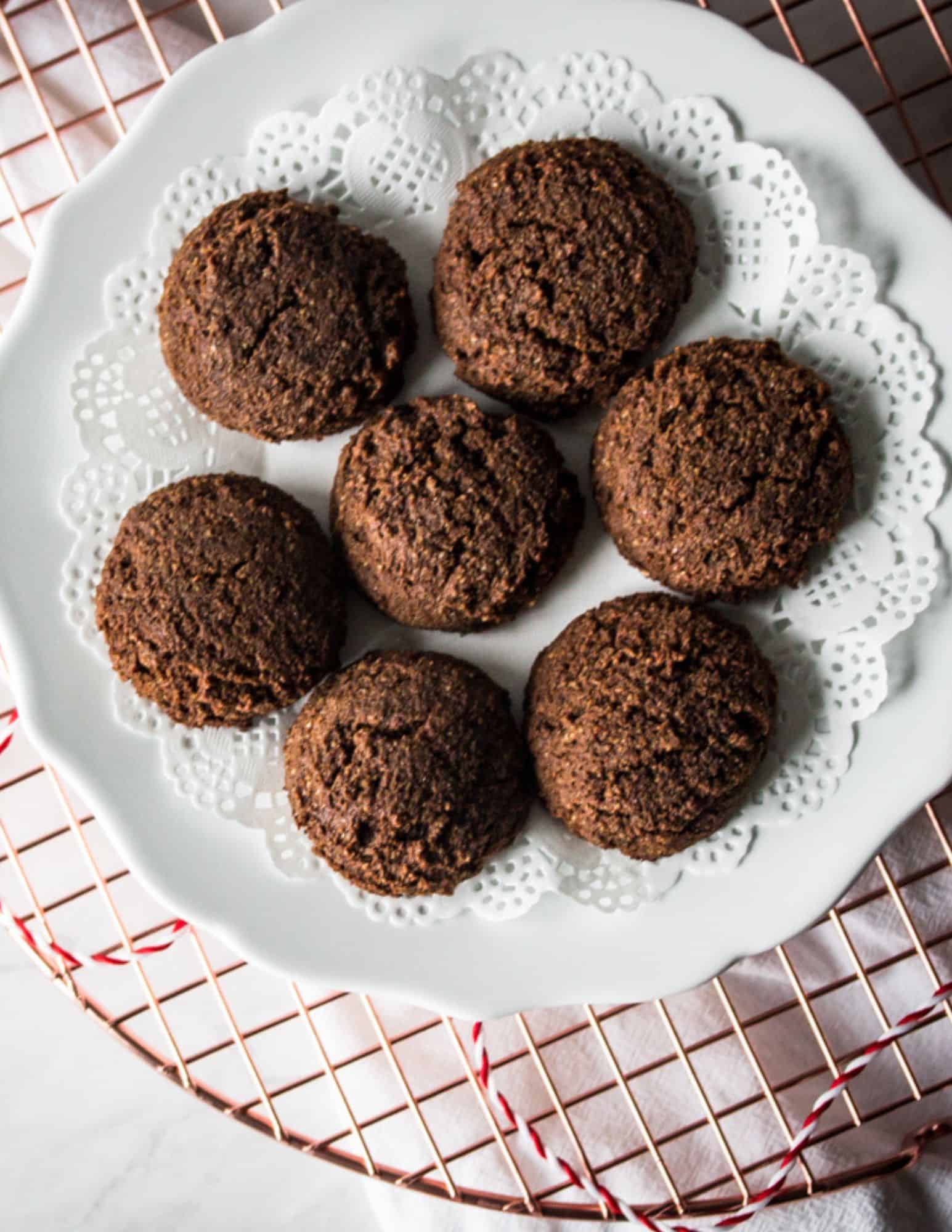a white plate of gluten free gingerbread cookies