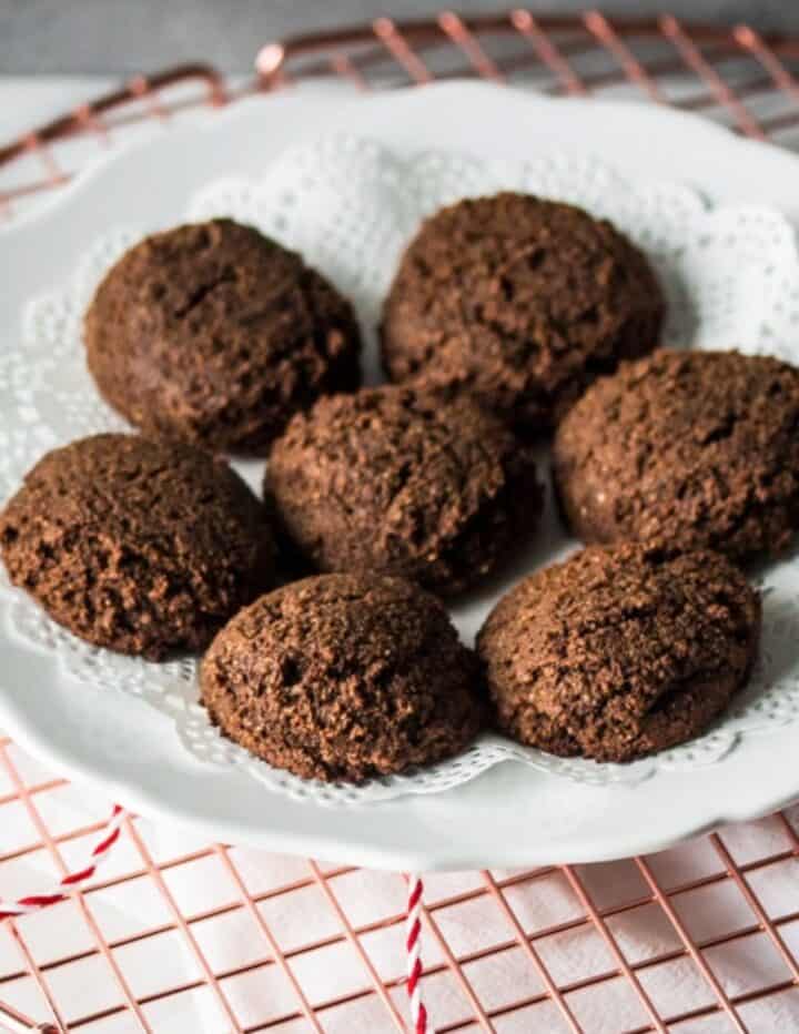a white plate of gluten free gingerbread cookies