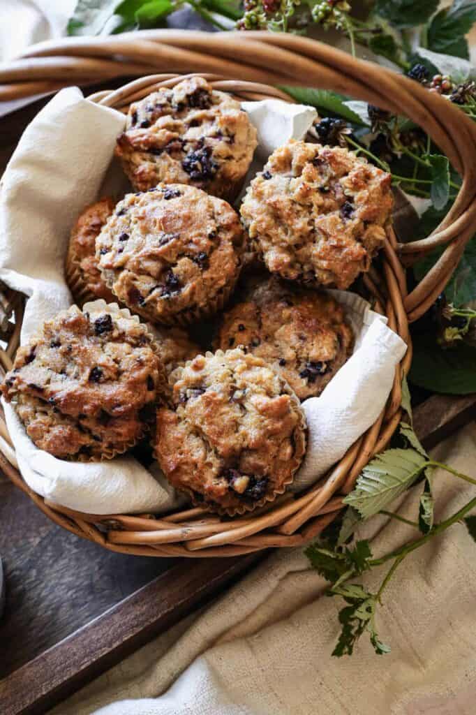 a basket of gluten free blackberry oat muffins