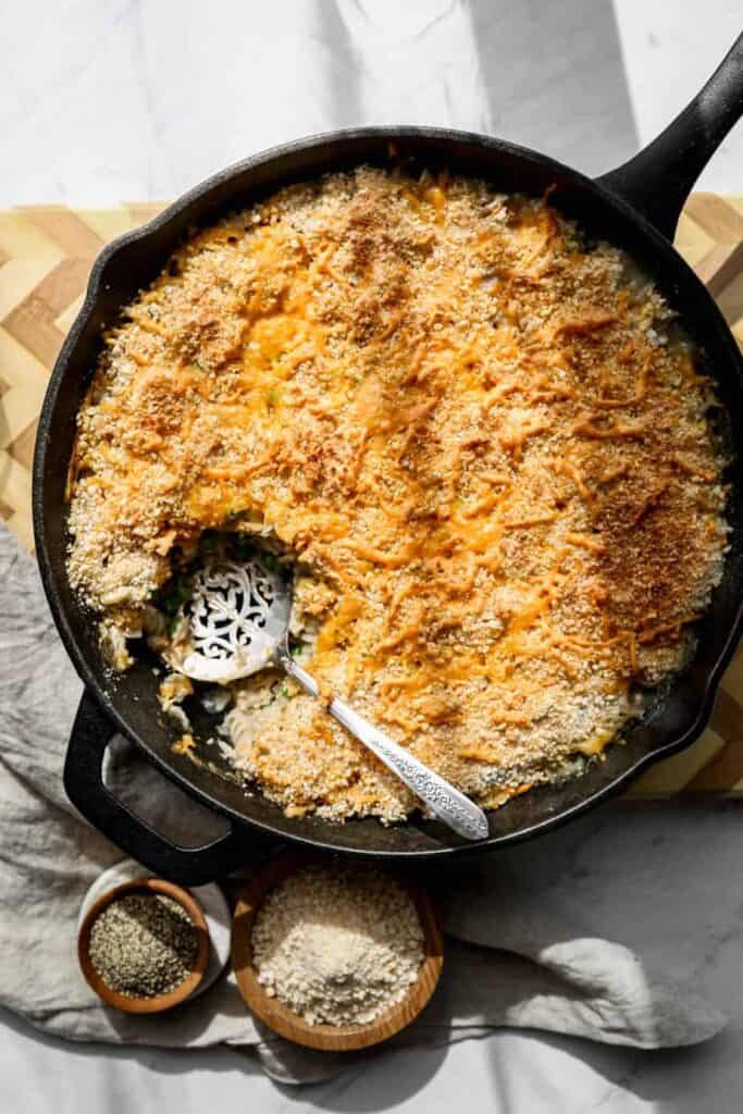 a twelve inch cast iron frying pan of gluten free tuna casserole skillet with shredded cheddar cheese and gluten free breadcrumbs browned on top