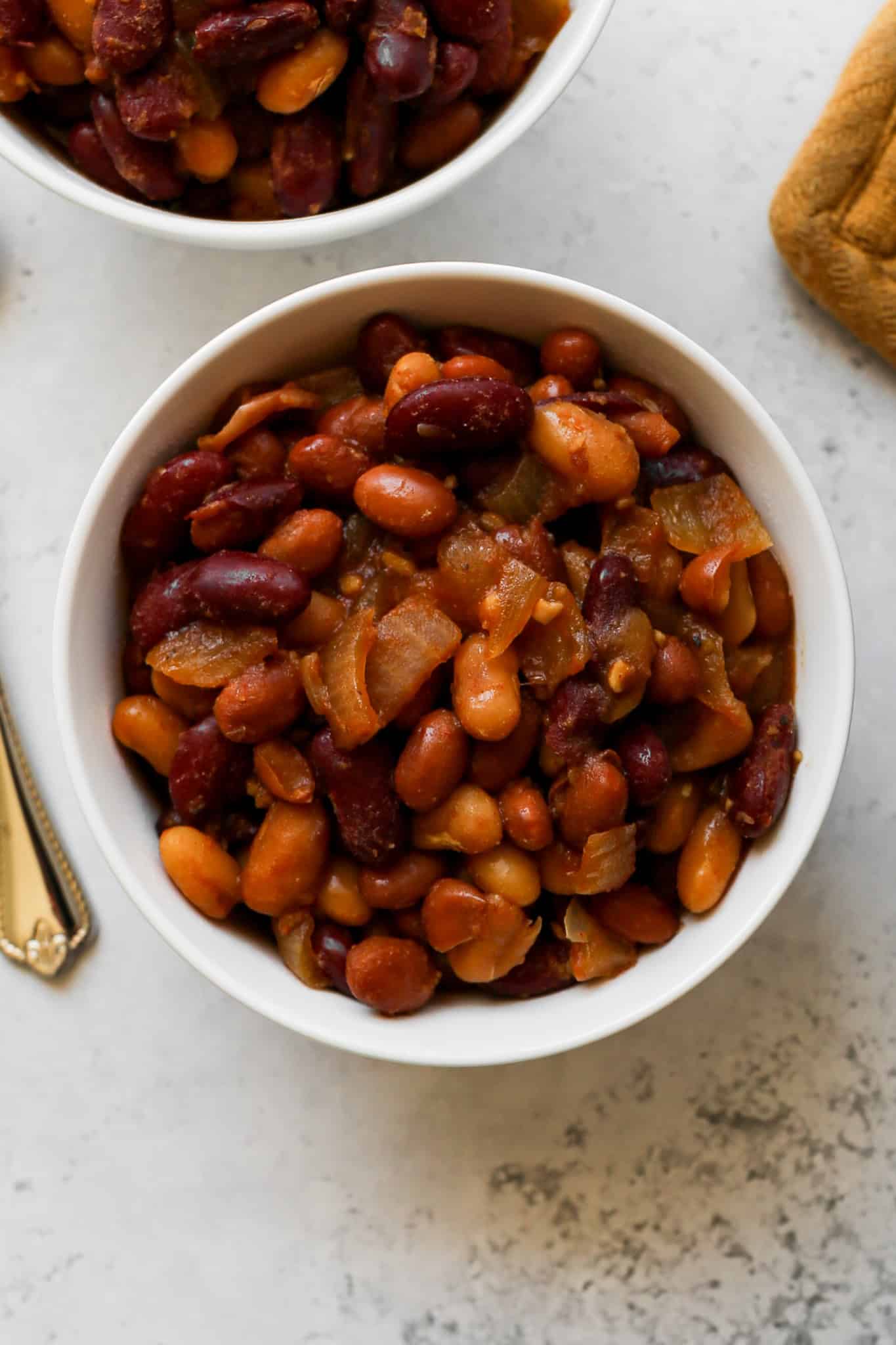 a white bowl of gluten free slow cooker baked beans