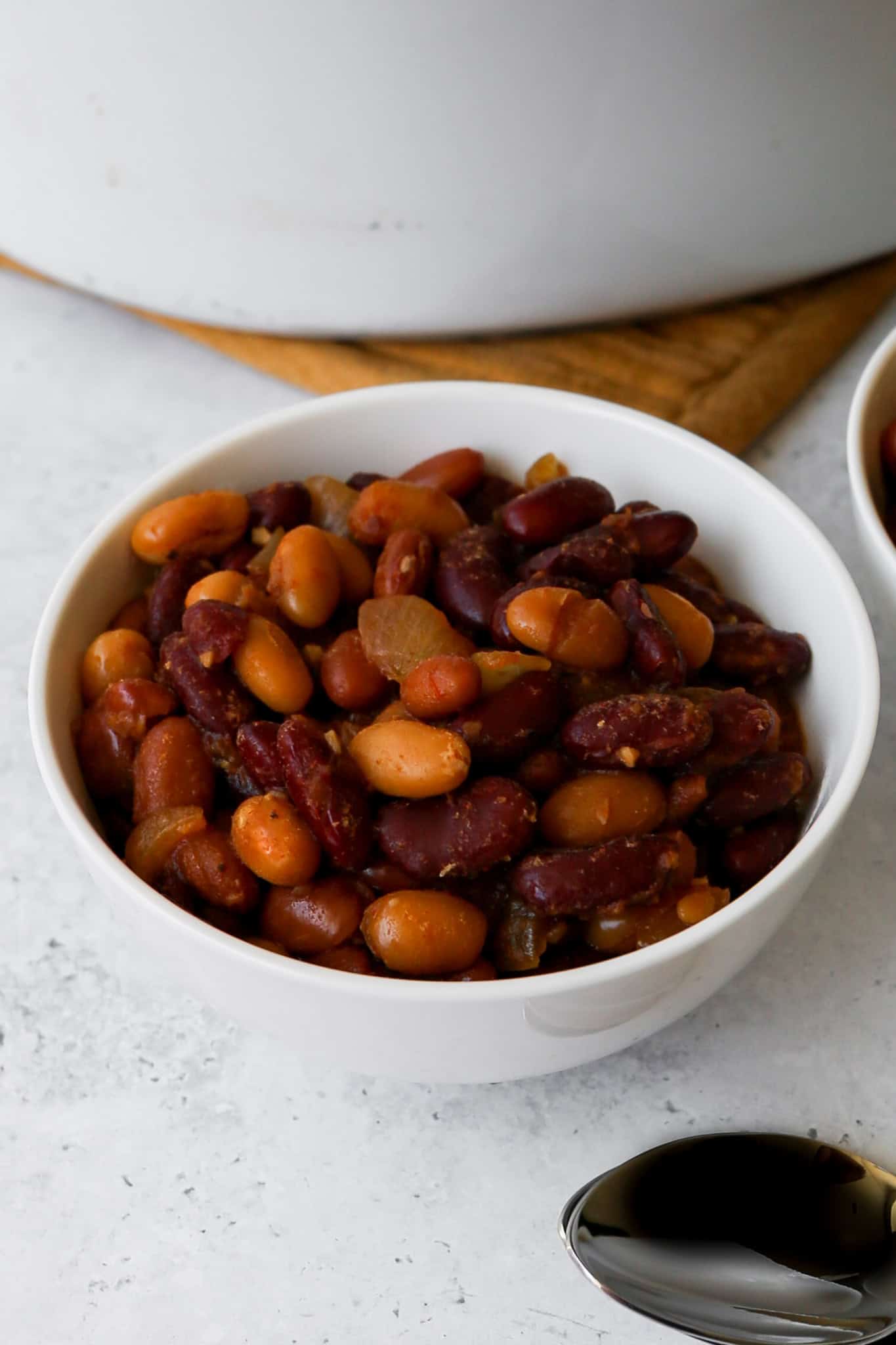a white bowl of gluten free slow cooker baked beans